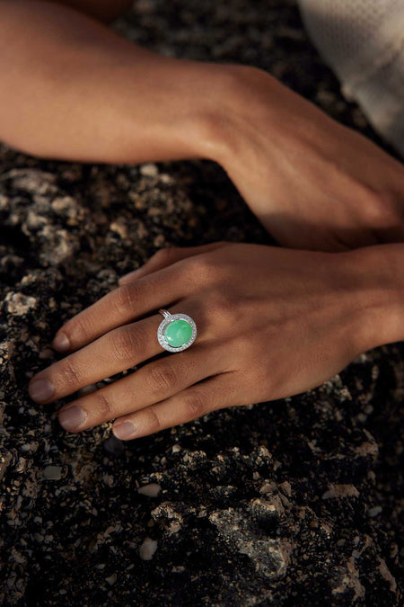 Close up of a woman's hand wearing a jade ring