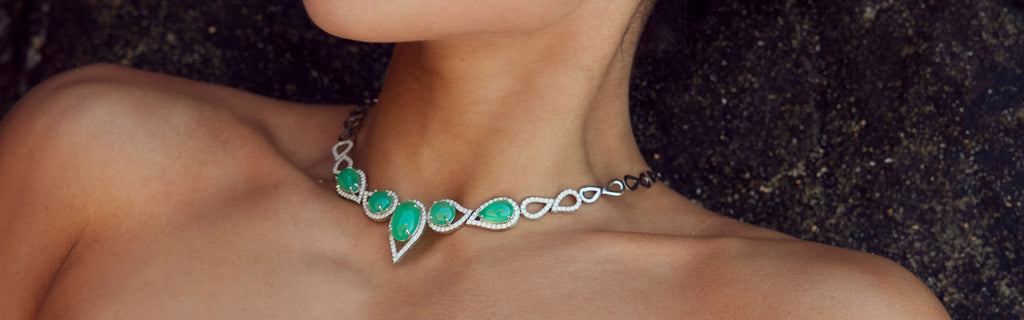 Woman wearing an exquisite diamond and jade necklace