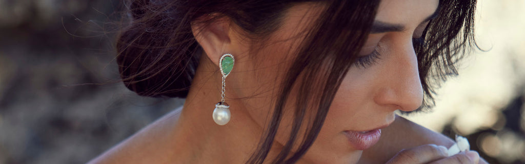 Woman wearing pearl and jade earings