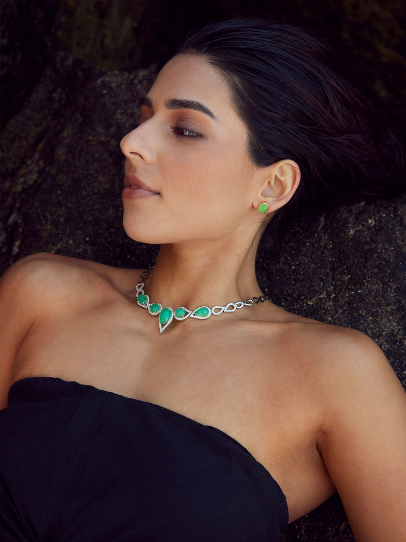 Woman wearing a jade an diamond necklace